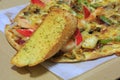 Seafood Pizza with garlic bread Royalty Free Stock Photo