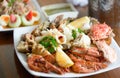 Seafood on plate with spicy tasty dipping sauce