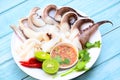 Seafood plate squid food on white plate, Fresh squid cooked boiled steam with vegetable salad lemon lime and seafood sauce chili