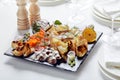 seafood platter. Assorted delicious seafood with vegetables. White background Royalty Free Stock Photo