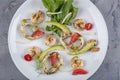 Seafood platter with deep fried squid rings, shrimp decorated with lemon on fresh arugula. Mediterranean appetizers. Top view Royalty Free Stock Photo