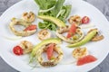 Seafood platter with deep fried squid rings, shrimp decorated with lemon on fresh arugula. Mediterranean appetizers. Top view Royalty Free Stock Photo