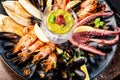 Seafood platter for 2-4 persons. Lobster, octopus, blue mussels, Argentina king prawns, tuna tartare. Delicious healthy Royalty Free Stock Photo