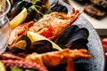 Seafood platter for 2-4 persons. Lobster, octopus, blue mussels, Argentina king prawns, tuna tartare. Delicious healthy Royalty Free Stock Photo