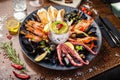 Seafood platter for 2-4 persons. Lobster, octopus, blue mussels, Argentina king prawns, tuna tartare. Delicious healthy Royalty Free Stock Photo