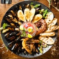 Seafood platter for 2-4 persons. Octopus, blue mussels, cooked green mussels, grilled tiger prawns, tuna tartare