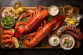 Seafood platter with a set of steamed whole lobsters, lobster tails, shrimps with lemon, sauces and white wine on wooden board. Royalty Free Stock Photo