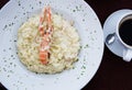 Seafood risotto dish with a big prawn on top Royalty Free Stock Photo