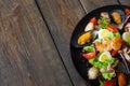 Seafood salad plate on wood half image copyspace