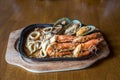 Seafood salad with prawns, mussels and squids. Fried stir spicy sea food in hot pan. Royalty Free Stock Photo