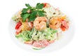 Tasty salad with prawns, vegetables and seaweed Chukka, dressed with sauce on a white plate. Salad in a plate isolated on white ba Royalty Free Stock Photo