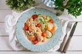 Seafood salad with vegetables. Shrimp, squid, with chopped cherry tomatoes, zucchini, carrots, daikon. Royalty Free Stock Photo