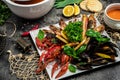 Seafood set. A plate full of cooked shrimp, fish, crayfish, mussels. banner, menu, recipe place for text, top view Royalty Free Stock Photo