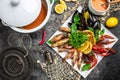 seafood set. A plate full of cooked shrimp, fish, crayfish, mussels. banner, menu, recipe place for text, top view Royalty Free Stock Photo