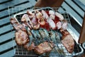 Seafood, shrimp, squid, pork for grilling,Seafood, shrimp, squid, pork On a grill for party concept Royalty Free Stock Photo