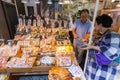 Seafood snack vendor dealing with customer