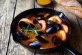 Seafood soup bouillabaisse. Mussels and shrimp in tomato sauce. The traditional dish of Marseilles. Rustic style. Royalty Free Stock Photo