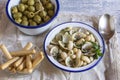 Seafood soup with olives and bread sticks