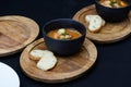 Seafood spicy soup with potatoes, shrimps, herbs and fish from a picad closeup in a pan served with toast. horizontal