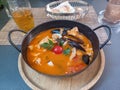 Seafood spicy soup with potatoes, shrimps, mussels, herbs and fish Royalty Free Stock Photo