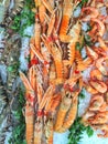 Seafood stall on a provencal market featuring raw tiger prawns a