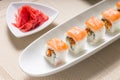 Seafood sushi rolls in white plate with chopsticks and japanese spices Royalty Free Stock Photo