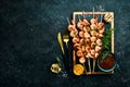 Seafood. Tiger prawns. Shrimp fried in skewers. On a stone background. Royalty Free Stock Photo