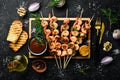 Seafood. Tiger prawns. Shrimp fried in skewers. On a stone background. Royalty Free Stock Photo