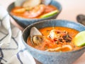 Seafood tomato soup in blue ceramic bowls. Mediterranean cuisine