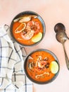 Seafood tomato soup in blue ceramic bowls. Mediterranean cuisine