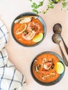 Seafood tomato soup in blue ceramic bowls. Mediterranean cuisine