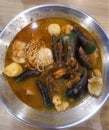 Seafood tomyam consist of green scallops, shrimp, fish ball, fish fillet, shitake mushroom with spicy gravy.