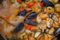 seafood and vegetable cooking close-up in frying pan. Top view. Mediterranian cuisine. Spanish traditional meal. Royalty Free Stock Photo