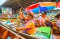 The seafood vendor, Damnoen Saduak floating market, Thailand