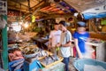 A seafood vendor at work in a public market in the Philippines. Royalty Free Stock Photo