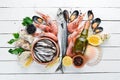 Seafood on a white wooden background. Fresh fish, shrimp, oysters and caviar. Royalty Free Stock Photo