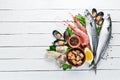 Seafood on a white wooden background. Fresh fish, shrimp, oysters and caviar. Royalty Free Stock Photo