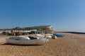 Seaford East Sussex beach, boats and white chalk cliffs