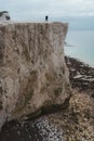 Seaford, East Sussex. People walking the paths on the top of the Chalk Cliffs. Seven Sisters, South of England