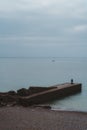 Seaford, East Sussex | UK. Men fishing early morning at the Seven Sisters West beach side Royalty Free Stock Photo