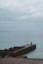 Seaford, East Sussex | UK. Men fishing early morning at the Seven Sisters West beach side Royalty Free Stock Photo