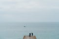 Seaford, East Sussex | UK -  2021.04.04: Men fishing early morning at the Seven Sisters West beach side Royalty Free Stock Photo