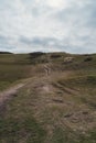 Seaford, East Sussex | UK. People walking the paths on the top of the Chalk Cliffs