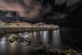 The seafront of Ortigia illuminated in the night