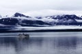 Seagoing Ship in a Cloudy Mountain Landscape Royalty Free Stock Photo