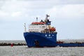 Seagoing vessels sailing past cause waves on the quays