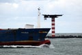 Seagoing vessels sailing past cause waves on the quays