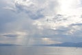 Seagull birds flying over the water with sun rays background. Bird Flying over Sun Rays. Scenic View Of Sea Against Sky. Royalty Free Stock Photo