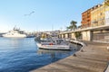 A seagull flies over boats docked at the Old Port in the Mediterranean city of Nice France on the French Riviera Royalty Free Stock Photo