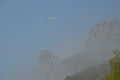 Seagull flying above the clouds. Clouds descended into the valley between the mountains. Crimea. Horus Cat